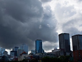 Storm clouds roll in over the skyline of Montreal on Wednesday June 18, 2014.  (Allen McInnis / THE GAZETTE)