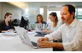 Philippe Telio finalizes arrangements Thursday for the fourth edition of the International Startup Festival with Pamela Perrotti, left, Rebecca Croll and Katherine Johnsen.