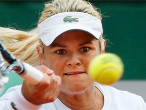 Canada’s Aleksandra Wozniak returns the ball during the first round match of the French Open tennis tournament against Romania’s Sorana Cirstea at the Roland Garros stadium, in Paris, France, Tuesday, May 27, 2014.