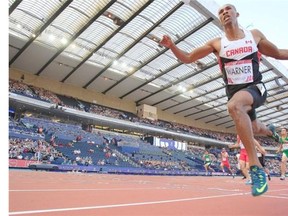 Canada’s Damian Warner, right, crosses the finish line during the men’s decathlon 100-metre competition at Hampden Park Stadium during the Commonwealth Games 2014 in Glasgow, Scotland, Monday July 28, 2014.