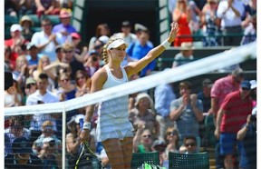 Canada’s Eugenie Bouchard celebrates winning her women’s singles quarter-final match against Germany’s Angelique Kerber on day nine of the 2014 Wimbledon Championships at The All England Tennis Club in Wimbledon, southwest London, on July 2, 2014. Bouchard won 6-3, 6-4.