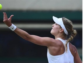 Canada’s Eugenie Bouchard serves to Germany’s Angelique Kerber during their women’s singles quarter-final match on day nine of the 2014 Wimbledon Championships at The All England Tennis Club in Wimbledon, southwest London, on July 2, 2014. Bouchard won 6-3, 6-4.