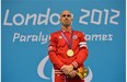 This file photo shows Canada's gold medallist Benoit Huot on the podium during the victory ceremony for the men's 200m individual medely at the London 2012 Paralympic Games on Aug. 30, 2012.