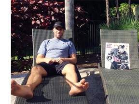 Canadiens defenceman Mike Weaver and a magazine poster of teammate Max Pacioretty are photographed lounging in Florida on June 6, 2014. Weaver has had the poster of Pacioretty, which first was taped up in his Montreal dressing-room area as a gag, with him this summer. He’s had them photographed together here and on an airplane, at poolside, in Weaver’s truck and on a golf course, tweeting every image. And Weaver vows their summer of fun has just begun.