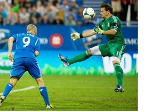 Chivas USA’s goalkeeper Dan Kennedy, right, makes a save against Montreal Impact’s Marco Di Vaio on Sunday, July 7, 2013. Chivas USA beat the Impact 1-0 in Saturday’s game.