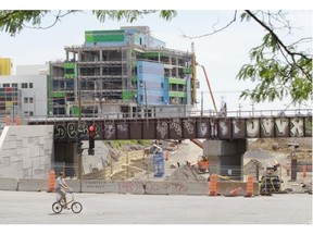 Construction at the MUHC superhospital project in Montreal, on Monday, June 23, 2014, with the de Maisonneuve and Décarie Blvd. underpass in the foreground. The deficit for the 2013-14 fiscal year at the McGill University Health Centre was $13.2 million, much lower than the $20 million anticipated, the board announced at its last annual meeting in mid-June.