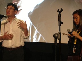 Jang Joo-hwan, left, director of the South Korean film Hwayi: A Monster Boy, answers a question from the audience at the Fantasia International Film Festival on Monday, July 21, 2014. Noeul Kang, right, did a great job of translating his replies into English  or French, depending on the language of the original question. (Liz Ferguson photo)