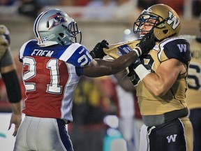 Mike Edem, seen here with Winnipeg's Michel-Pierre Pontbriand, had a pregame disagreement with the Lions' Khreem Smith.
John Mahoney/The Gazette