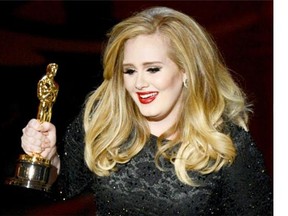 Singer Adele, accepting Best Original Song Oscar in 2013, won an out-of-court settlement from a British photo agency over pictures of her 2-year-old son Angelo. 
 Kevin Winter/Getty Images