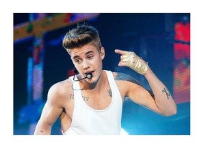 Singer Justin Bieber performs during a concert at Bercy Arena in Paris on April 1. Francois Mori/Associated Press files