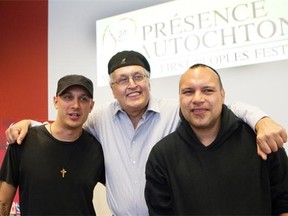 Montreal First Peoples’ Festival chairman and artistic director André Dudemaine is flanked by rapper Samian, left, and Innu hip-hop artist Shauit during the event’s lineup announcement on June 16.