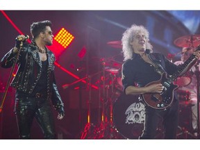 Queen's lead guitarist Brian May ( R ) and new vocalist Adam Lambert  ( L ) perform in concert at Rogers Arena, Vancouver, June 28 2014