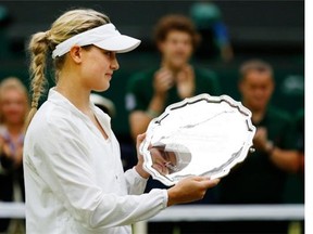 Eugenie Bouchard of Canada holds her runner’s-up trophy after being defeated by Petra Kvitova of the Czech Republic in the women’s singles final at the All England Lawn Tennis Championships in Wimbledon, London, Saturday, July 5, 2014.