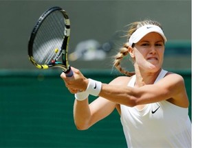 Eugenie Bouchard of Canada plays a return to Angelique Kerber of Germany during their women’s singles quarter-final match at the All England Lawn Tennis Championships in Wimbledon, London, Wednesday, July 2, 2014.
