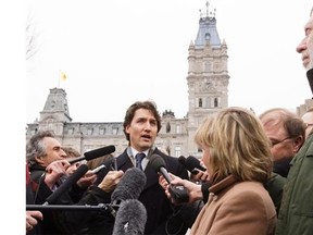 Federal Liberal Leader Justin Trudeau talks to media outside the legislature in Quebec City, Thursday, April 18, 2013.