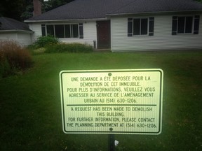 Public notice in front of house at 28 Fifth Ave. advised residents of demolition request.