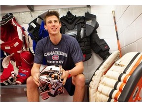 Goalie Hayden Hawkey, sitting in the locker room, is among the players at the Canadiens development camp held at the Brossard Bell Sports Complex.