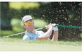 Graham DeLaet from Canada plays a shot from the bunker during the Pro-Am tournament at the 2014 RBC Canadian Open at the Royal Montreal Golf Club in Montreal, Monday, July 21, 2014.