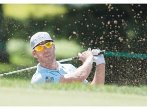 Graham DeLaet from Canada plays a shot from the bunker during the Pro-Am tournament at the 2014 RBC Canadian Open at the Royal Montreal Golf Club in Montreal, Monday, July 21, 2014.