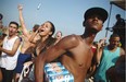 An informal beach vendor carries beer for sale on Copacabana Beach on June 28, 2014 in Rio de Janeiro, Brazil. The beach has seen a proliferation of informal vendors from both Brazil and abroad as tourists have gathered for the World Cup.