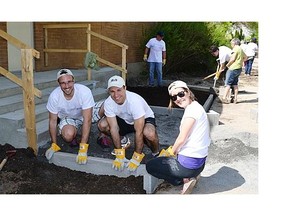 From left, Corvée BLG participants law intern Nicolas Drolet, lawyer Jean-Philippe Herbert and employee Joëlle Castonguay of the Montreal office of Borden Ladner Gervais rolled up their sleeves to benefit the Fondation du Dr Julien.