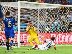 Mario Goetze of Germany scores his team’s first goal past Sergio Romero of Argentina in extra time during the 2014 FIFA World Cup Brazil Final match between Germany and Argentina at Maracana on July 13, 2014 in Rio de Janeiro, Brazil.