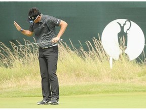 Masanori Kobayashi of Japan reacts to a missed putt during the second round of The 143rd Open Championship at Royal Liverpool on July 18, 2014 in Hoylake, England.