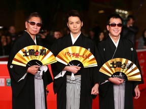 Director Takashi Miike, left, actor Toma Ikuta and writer Noboru Takahashi attend the 'The Mole Song' premiere during the Rome Film Festival at Auditorium Parco Della Musica on November 15, 2013 in Rome, Italy.  (Vittorio Zunino Celotto/Getty Images)