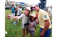 Mike Weir, from Brights Grove, Ont., poses for a selfie with Kaylee Chin, left, and Maya Cunningham, centre, during the pro-am event at the Canadian Open golf championship Wednesday, July 23, 2014 at Royal Montreal golf club in Montreal.