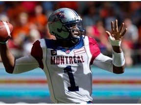 Montreal Alouettes quarterback Troy Smith passes — well, tries to anyway — against the B.C. Lions during the first half in Vancouver on Saturday July 19, 2014. Smith went 5-for-17 for 45 yards.
