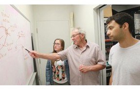 McGill neuroscience professor and researcher Dan Guitton, centre, of the Montreal Neurological Institute talks about findings on stimuli for studies of the brain’s visual system with PhD students Sujaya Neupane, right, and Kate Rath-Wilson at the institute in Montreal.
