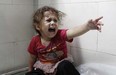 A Palestinian child shouts at al-Shifa hospital after Israeli forces shelled her house in Gaza City on July 18, 2014. Israel began a ground operation in Gaza as a deadly offensive to stamp out rocket fire from the Hamas-run enclave that has cost 247 Palestinian lives entered its 11th day on July 18.