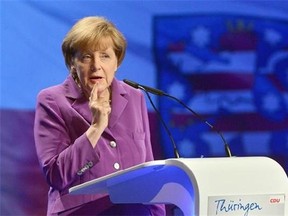 German Chancellor Angela Merkel delivers a speech at the general meeting of the Thuringian Christian Democratic Party in Jena, Germany, Saturday July 12, 2014. Secusmart, a German encryption company used by Merkel to help counter spying, has been bought by BlackBerry.
