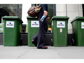 A pedestrian walks past a Cascades recycling display in Montreal in 2009.