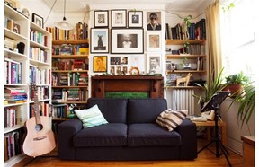 Photos, artworks and books surround the fireplace in Scott MacLeod’s apartment.