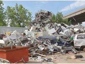 A pile of scrap, including bicycles, vans and hot water tanks, at Century Steel Inc. in Lachine.