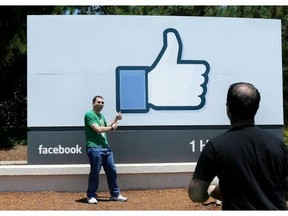 A man poses for photographs in front of the Facebook sign on the Facebook campus in Menlo Park, Calif. ‘Facebook knows it can push its users’ limits, invade their privacy, use their information and get away with it,’ said James Grimmelmann, a professor of technology and the law at the University of Maryland.
