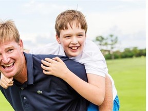 Professional golfer Ernie Els in a 2013 photograph with his son, Ben. Els, who is playing this week in the RBC Canadian Open, works to raise awareness of and help those afflicted with autism, which includes his son.
