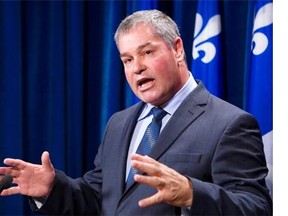 Quebec Education Minister Yves Bolduc will return $55,072.50 split between the RAMQ and two charities.