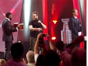 Seth Rogen has P.K. Subban deliver beer to be put in the Stanley Cup at the end of the gala he hosted at Just for Laughs at Salle Wilfrid Pelletier in Montreal, Saturday July 26, 2014.