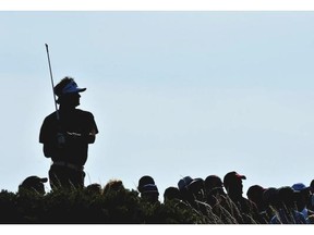 A silhouette of Bubba Watson of the United States during the first round of The 143rd Open Championship at Royal Liverpool on July 17, 2014 in Hoylake, England.