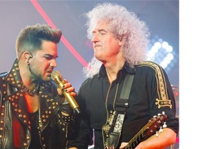 Singer Adam Lambert with original Queen guitarist Brian May in concert at the Bell Centre in Montreal, Monday July 14, 2014.