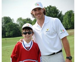 Canadiens forward Brandon Prust poses with Liam Hepburn, a cancer survivor, at 2012’s Prusty 4 Kids charity golf tournament in London, Ont. This year’s tournament will be held July 29 at Redtail Golf Course in Port Stanley, Ont., in support of the Prust-supported Kids Kicking Cancer program at Children’s Hospital, London Health Sciences Centre.