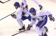 Charles Hudon, left, competes against Nikita Scherbak during the last day of the Canadiens’ development camp in Brossard on Friday. Hudon scored two goals during the scrimmage that followed.