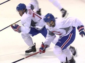 Charles Hudon, left, competes against Nikita Scherbak during the last day of the Canadiens’ development camp in Brossard on Friday. Hudon scored two goals during the scrimmage that followed.