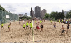 Staff at 29 Montreal bars and restaurants gather for beach volleyball tournament organized by Head & Hands at Jeanne Mance Parc in Montreal on Sunday to raise money for sex education.