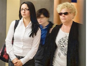This file photo shows Emma Czornobaj, left, at the Montreal courthouse on Monday, June 2, 2014.