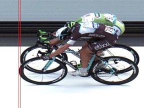 In this photo finish image released by ASO Italy’s Matteo Trentin, front, crosses the finish line ahead of second place Peter Sagan of Slovakia, rear, to win the seventh stage of the Tour de France cycling race over 234.5 kilometres (145.7 miles) with start in Epernay and finish in Nancy, France, Friday, July 11, 2014.