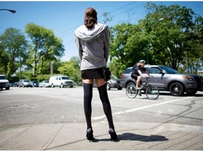 A sex trade worker is pictured in downtown Vancouver, B.C., Wednesday, June, 3, 2014.