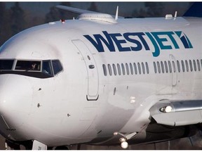 A pilot taxis a Westjet Boeing 737-700 to a gate in Vancouver on February 3, 2014. Boeing is working on a modified version of the plane to fit up to 200 passengers.